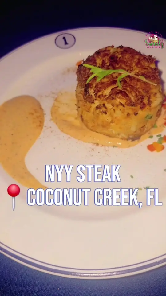 NYY Steak in Coconut Creek showing cocktail, lemon drop martini, food, jumbo lump crab cake, video by mimisweetkush on TikTok