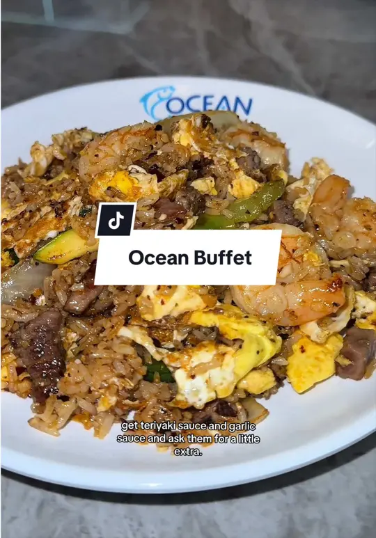 Ocean Buffet in Riverdale showing hibachi, spicy crab stick roll, pepper chicken, garlic bread, teriyaki sauce, garlic sauce, video by shantheleo on TikTok