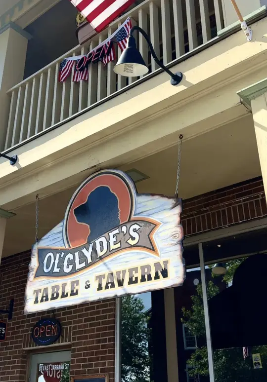 Ol’ Clyde's Table and Tavern in Cleveland showing food, fried pickles / food, pulled pork sandwich / food, catfish / drink, signature cocktails, video by pinevalleycabinsgeorgia on TikTok