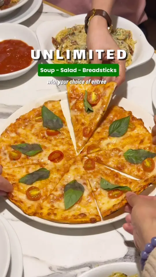 Olive Garden Italian Restaurant in Augusta showing unlimited soup, salad, breadsticks, penne pesto, creamy spinach fettuccine, tuscan spaghetti, video by How To Food Trip PH on Facebook