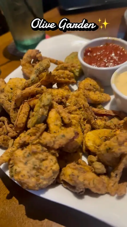 Olive Garden Italian Restaurant in Tampa showing food, fried shrimp & peppers, video by Piedmont Aviation Snack Bar on Facebook