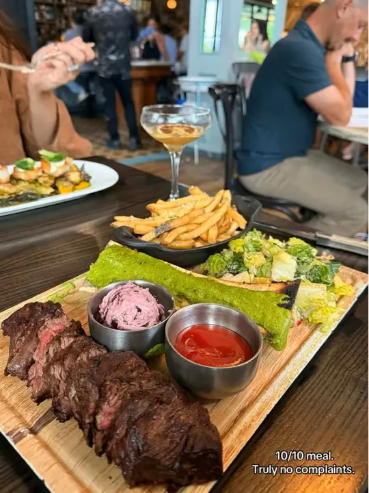 On Swann in Tampa showing food review, steak frittes, bone marrow, video by shyannalisha on TikTok