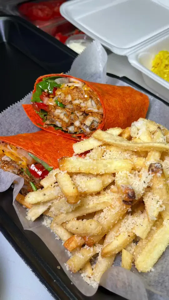 Our Bar ATL in Atlanta showing food, jerk chicken quesadilla, hot honey catfish wrap, video by callmecandace.tv on TikTok