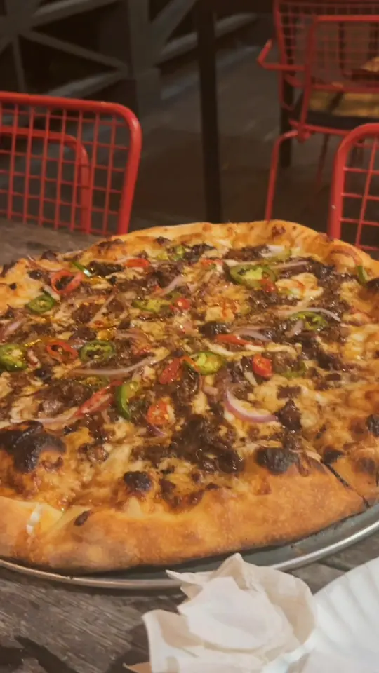 Outcast Pizza in Santa Rosa Beach showing pizza, oxtail pizza, video by lex.laprell on TikTok