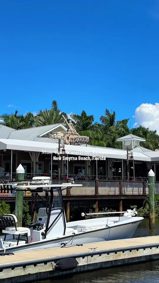 Outriggers Tiki Bar & Grille in New Smyrna Beach showing visit, review, brunch, cluck norris, belgian waffles, bangin shrimp, tuna triangles, florida's freshest catch, video by guidedbydestiny on TikTok