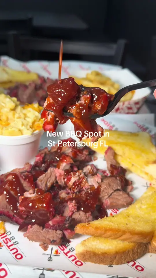Outside BBQ in St. Pete Beach showing food, homemade lemonades, loaded brisket fries, brisket combo, mac and cheese, collard greens, potato salad, video by tampaiman on TikTok