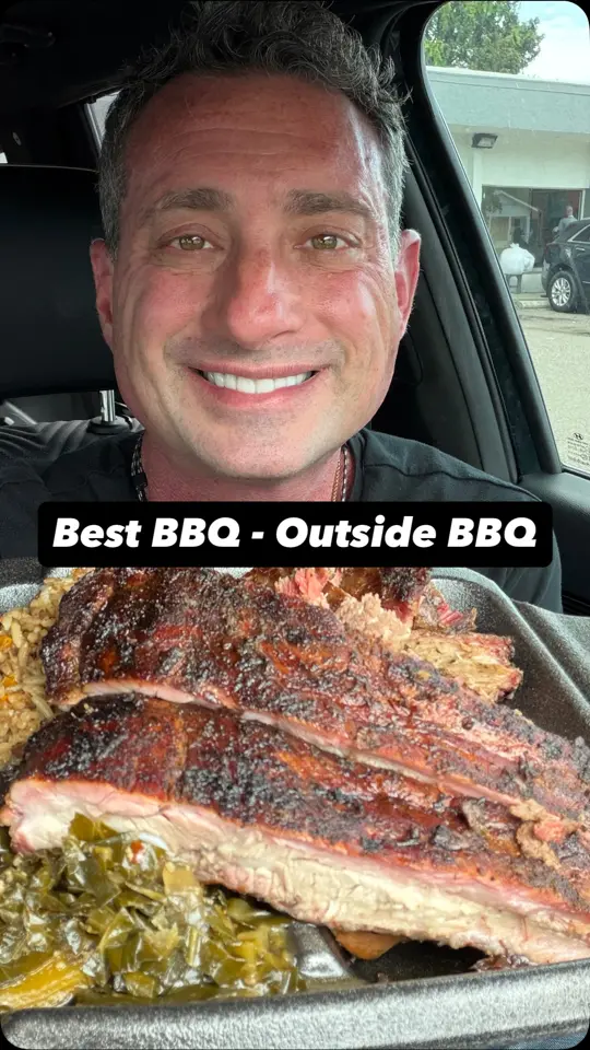Outside BBQ in St. Pete Beach showing ribs, brisket, greens, dirty rice, video by Foodie Justice on Facebook