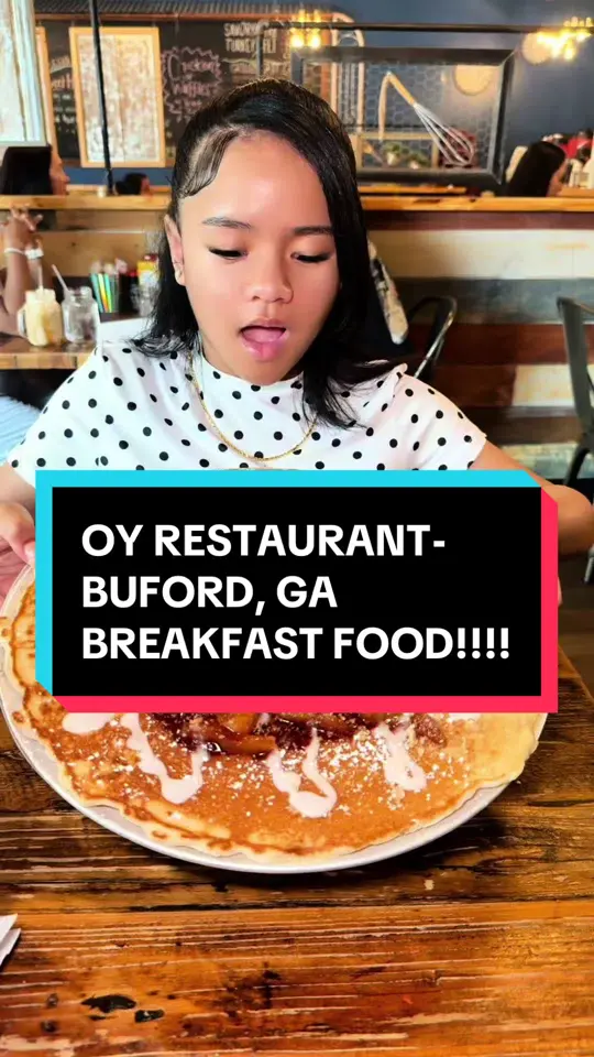 Oy! in Buford showing food, 14-inch apple cobbler pancake, classic pancakes, fluffy scrambled eggs, crispy bacon, sausage, buttery grits, video by aubreyandnikki on TikTok