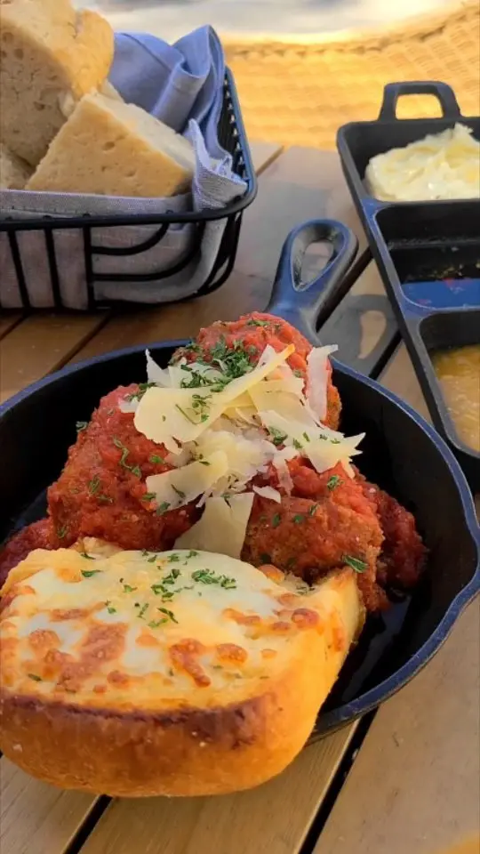Pacci Italian Kitchen + Bar in Savannah showing marinara meatballs, garlic bread, focaccia, negroni, video by Pacci Italian Kitchen + Bar on Facebook
