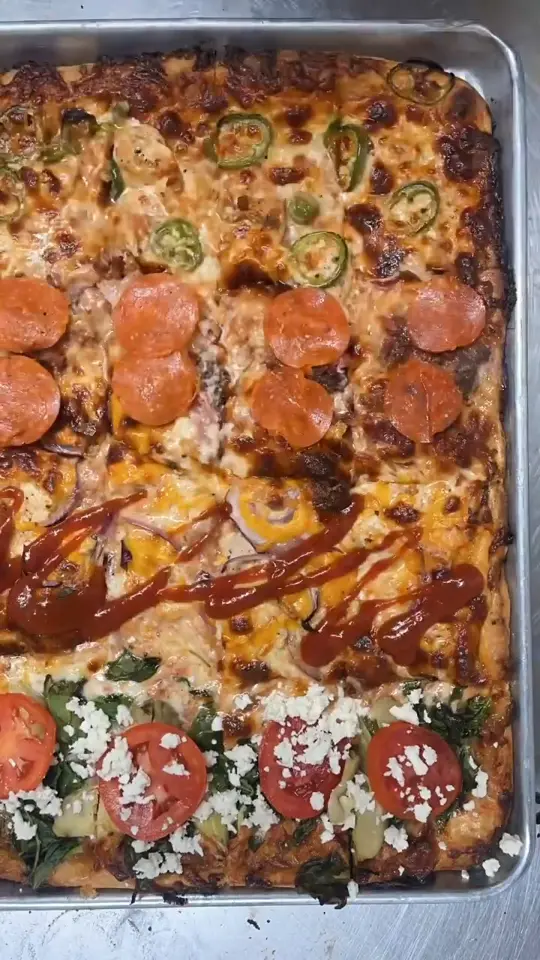 Panheads Pizzeria in New Smyrna Beach showing pizza, pizza flight, video by Visit New Smyrna Beach on Facebook