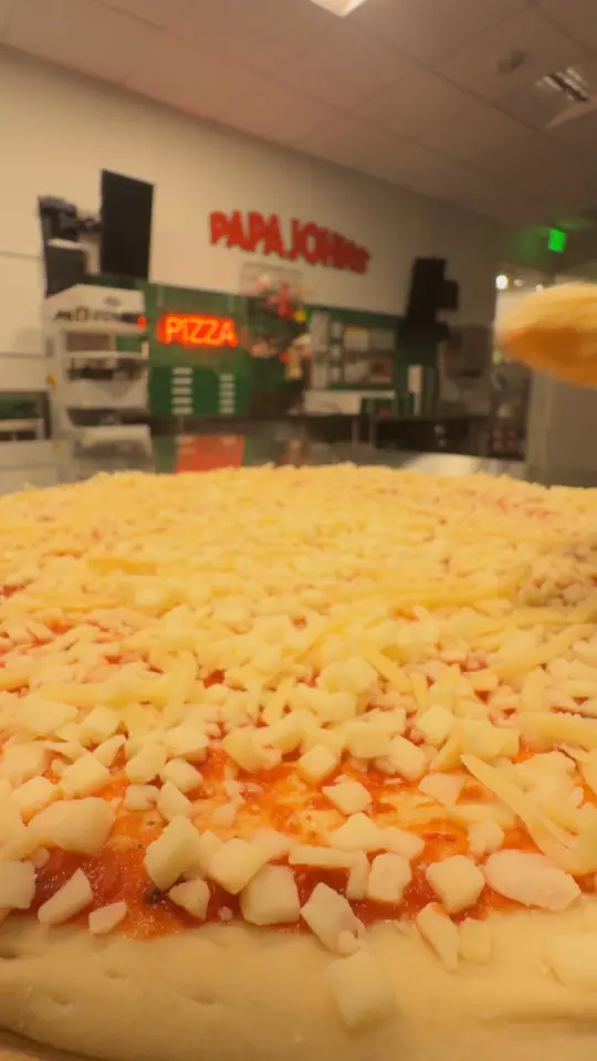 Papa Johns Pizza in Palm Coast showing pizza, largest pizza, video by Papa Johns Pizza on Facebook