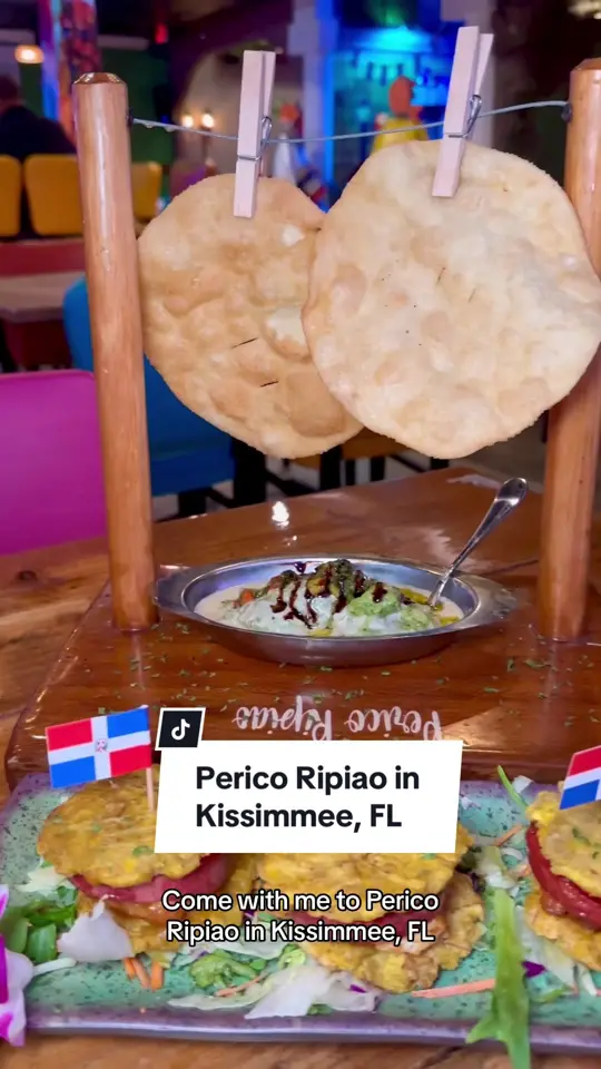 Perico Ripiao Latin Food in Kissimmee showing review, visit, ambience, cocktails, margarita, sancocho, paella with salmon, coconut dessert, video by christinainitalia on TikTok