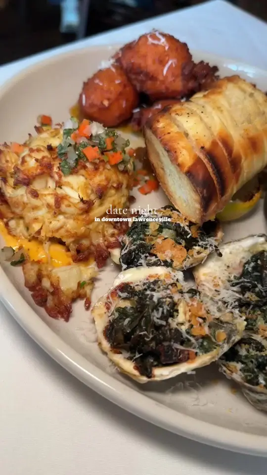 Perry St. Chophouse in Lawrenceville showing review, hot appetizer platter, pimento cheese fritters, oyster rockefeller, blackened shrimp, soy glazed pork belly, crab cake, delmonico ribeye, bone marrow, video by madoleapproved on TikTok