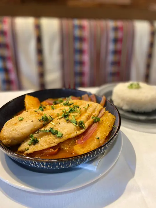 Peru Wok Cuisine in Jupiter showing food, sudado de pescado, video by Peru Wok on Facebook