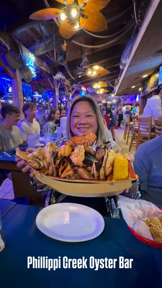Phillippi Creek Oyster Bar in Sarasota showing restaurant, family place, king's seafood broil, video by Samantha Cantrell on Facebook