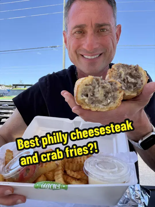 Philly's Best Cheesesteak House in Spring Hill showing cheesesteak, crab fries, video by foodiejustice on TikTok