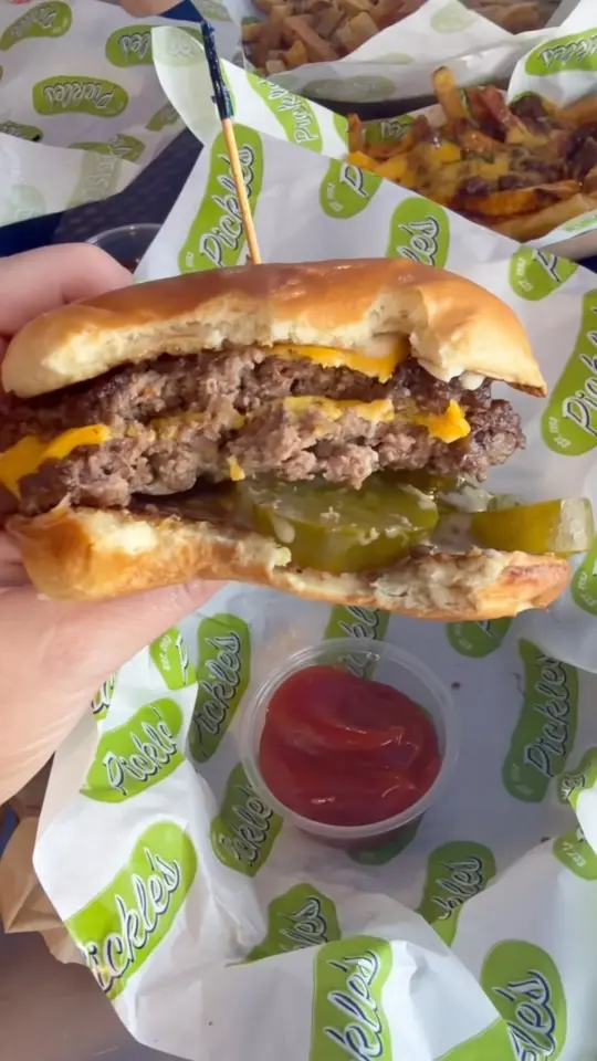 Pickle's Burger And Shake in Santa Rosa Beach showing food, smash burger, pickles, video by Amy Ivey Elizabeth Belle Eats on Facebook