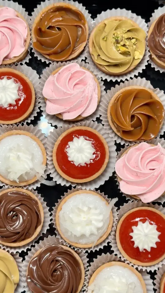 Pinecrest Bakery - Sweetwater in Miami showing mini tartaletas, pistachio, chocolate, guava, coconut, dulce de leche, video by Pinecrest Bakery on Facebook