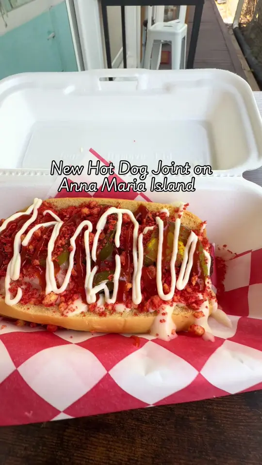 Pink Coney club in Holmes Beach showing food, nauti dog, video by pinkconeyclub on TikTok
