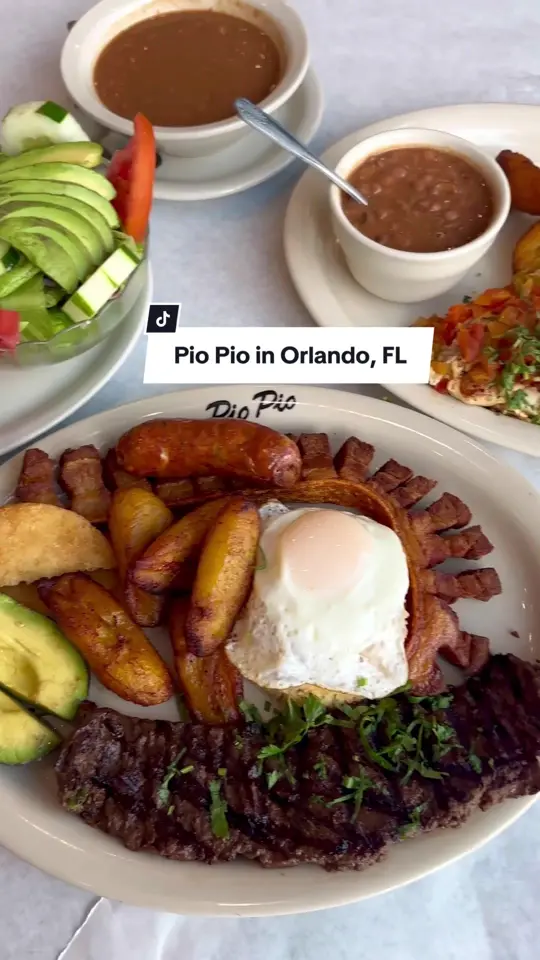 Pio Pio Latin Cuisine in Orlando showing visit, ambience, food, empanadas, bandeja paisa, colombian style ceviche, video by christinainitalia on TikTok