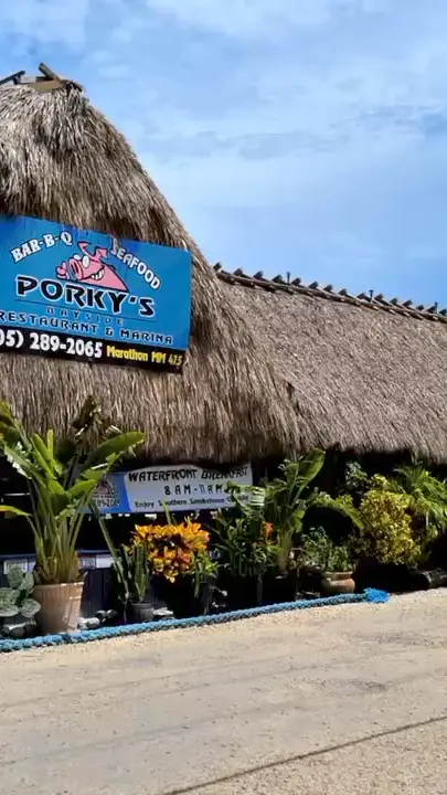 Porky's Bayside Restaurant and Marina in Marathon showing waterfront dining, food, drinks, video by Porky's Bayside BBQ on Facebook