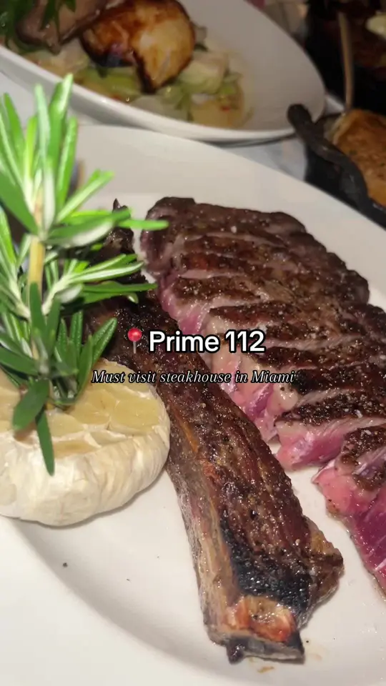 Prime 112 in Miami Beach showing bone-in ny strip, hearts of romaine caesar, truffled lobster mac n cheese, seared diver scalps, soy marinated chilean sea bass, hash browns, video by jleeliving on TikTok