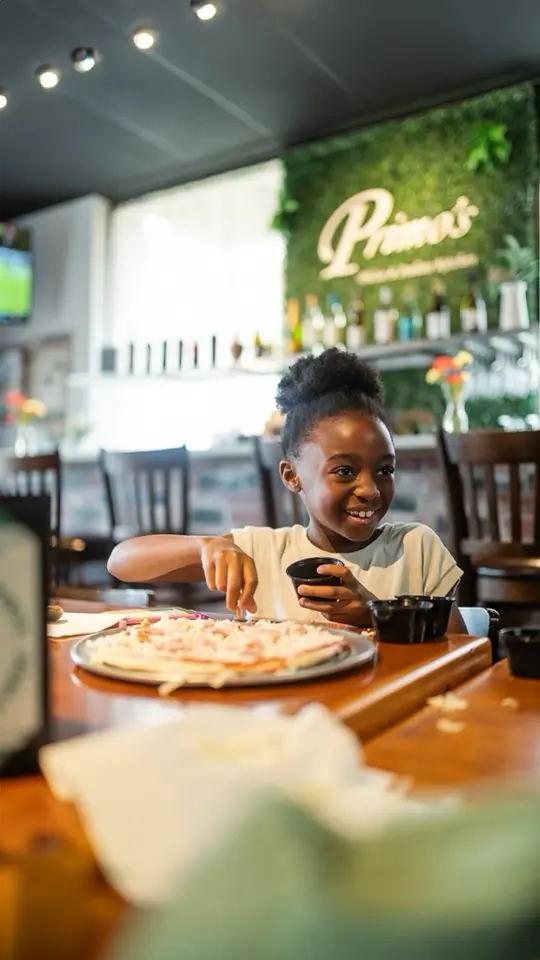 Primo's Pizza and Italian Kitchen in Woodstock showing pizza, italian dishes, board games, make-your-own pizza, video by Nicole Cole on Facebook