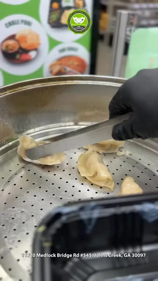Rajulas Kitchen in Johns Creek showing food, tandoori momos, video by Indiaco Atlanta on Facebook