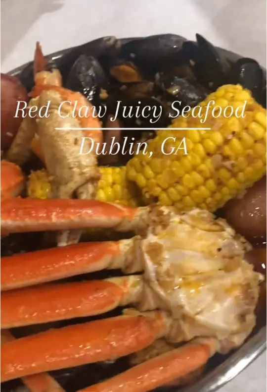 Red Claw Juicy Seafood in Dublin showing seafood boil, shrimp, snow crab legs, corn, potatoes, sausage, video by atl.foodie.1 on TikTok