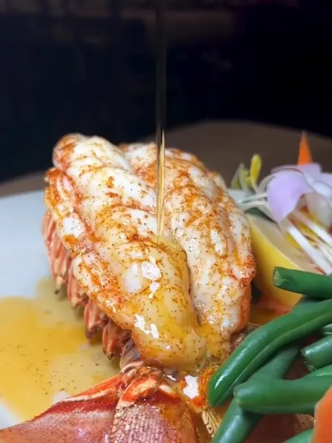 Riggins Crabhouse in Lantana showing giveaway, lobster dinner, lobster dishes, video by Riggins Crabhouse on Facebook