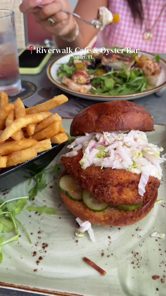 Riverwalk Cafe and Oyster Bar in Stuart showing food, grouper sandwich, video by itscayleesmith on TikTok