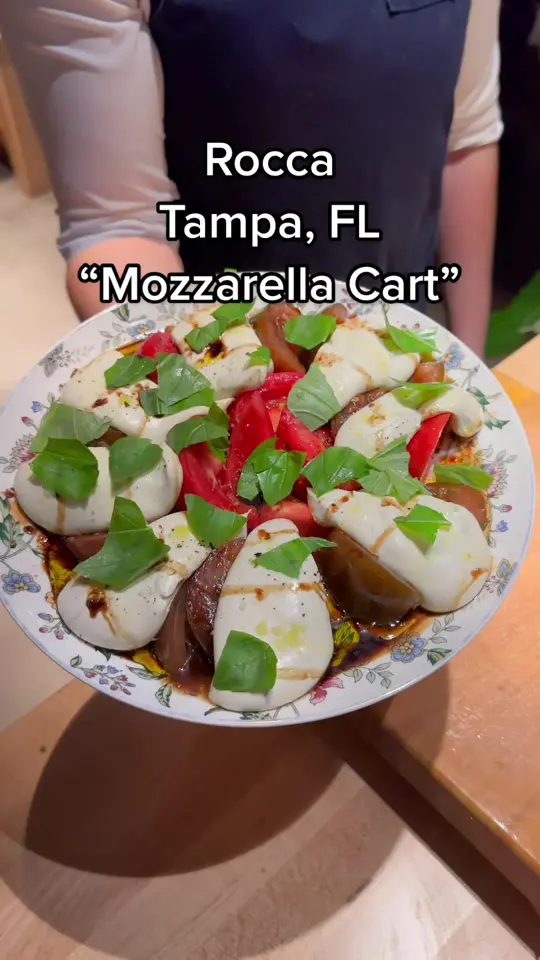 Rocca in Tampa showing food review, mozzarella cart, cheese pull, video by highspeeddining on TikTok