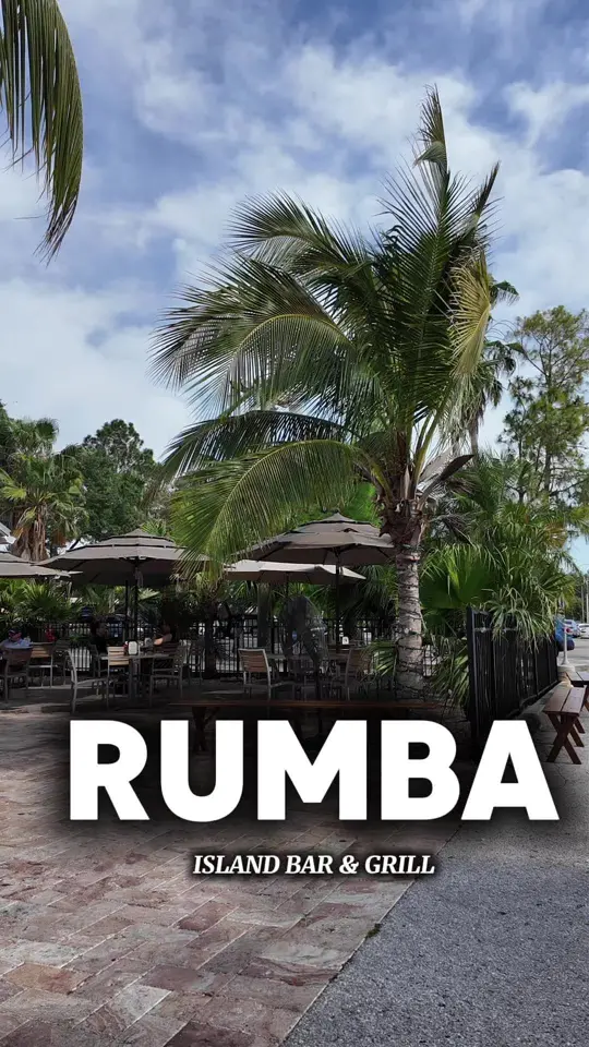 Rumba Island Bar & Grill in Clearwater showing food, cornbread mini muffins, jerk chicken wings, surf and turf, bubbling blueberry lemon drop, video by kayskamm on TikTok