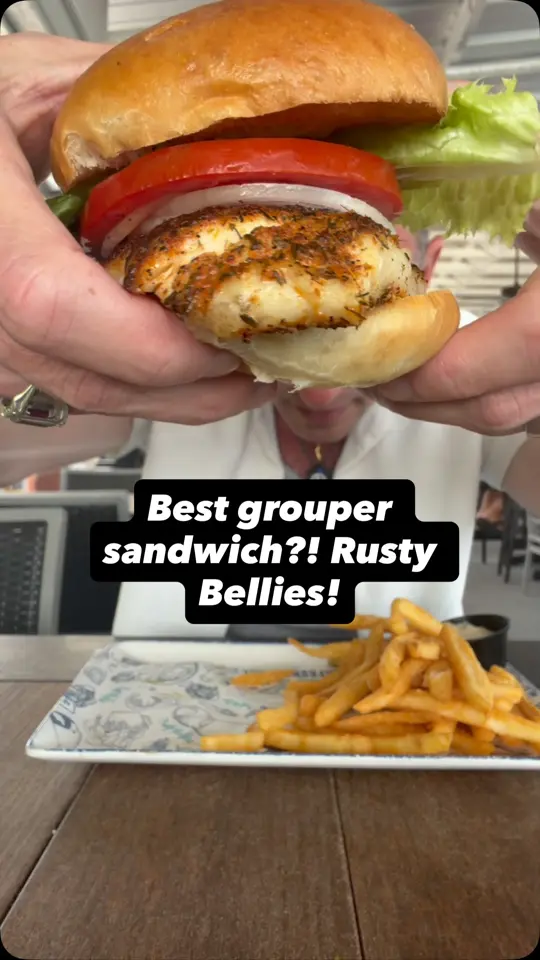 Rusty Bellies Waterfront Grill, Inc. in Tarpon Springs showing food review, grouper sandwich, video by Foodie Justice on Facebook