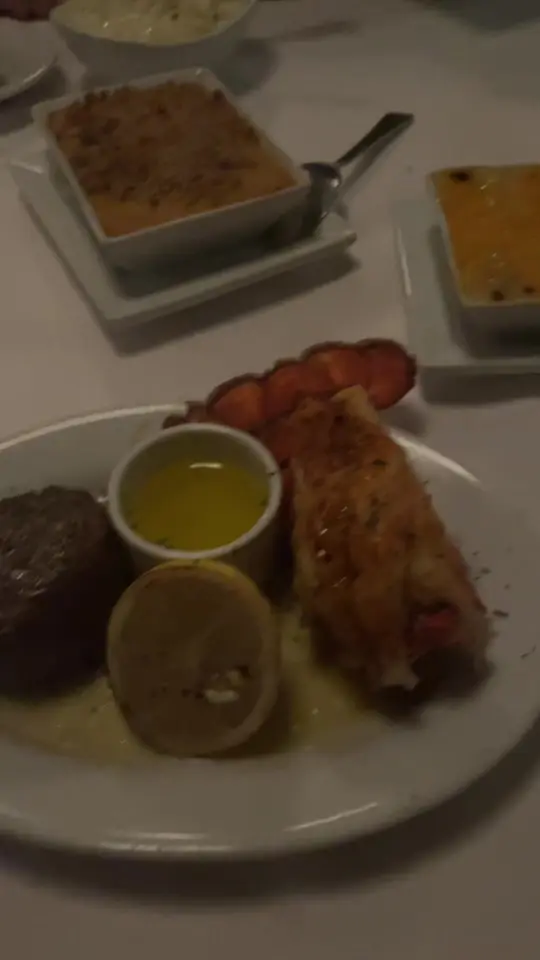 Ruth S Chris Steak House Jupiter in Florida showing food, steak, lobster, garlic mashed potatoes, surf and turf, video by freezingthemind on TikTok