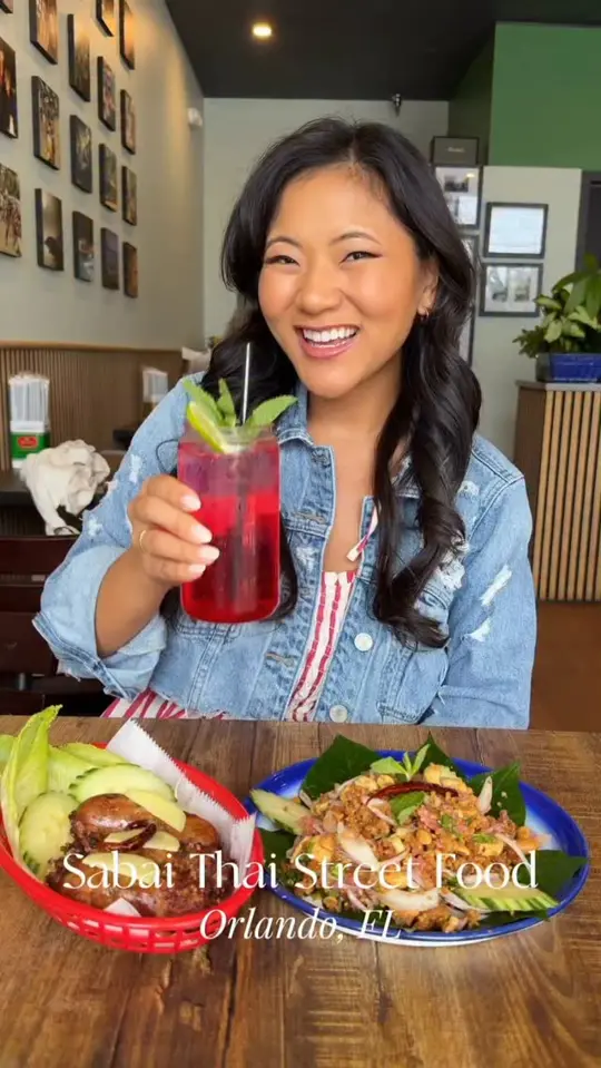 Sabai Thai Street Food in Orlando showing food, homemade sabai isan sausage, signature tom yum noodle soup, video by Taylor Shennett on Facebook