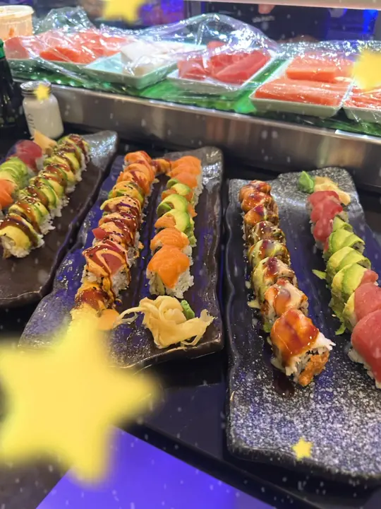 Sakura Sushi Bar in West Miami showing food, special rolls, drinks, bottle beer, video by Sakura Sushi DSM on Facebook