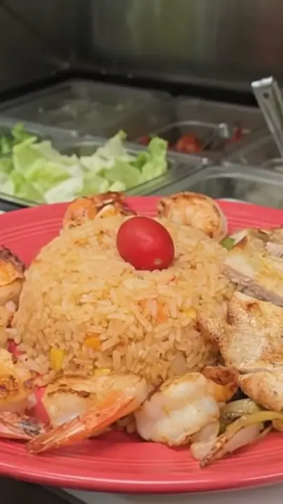 Salsa Latina in Albany showing food, shrimp brochetas, video by Salsa Latina Restaurant on Facebook