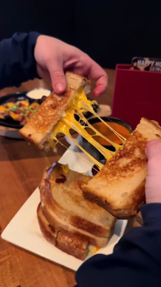 Sammy J's in Stuart showing food, cheese pull, video by sammyjsgrillandbar on TikTok
