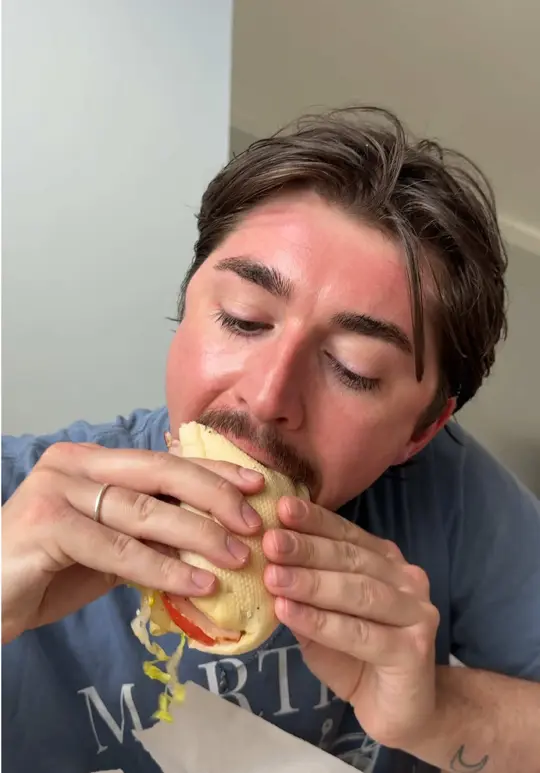 Sandos Beachside Cafe & Bar in Destin showing sandwich, chips, review, video by calsipos on TikTok