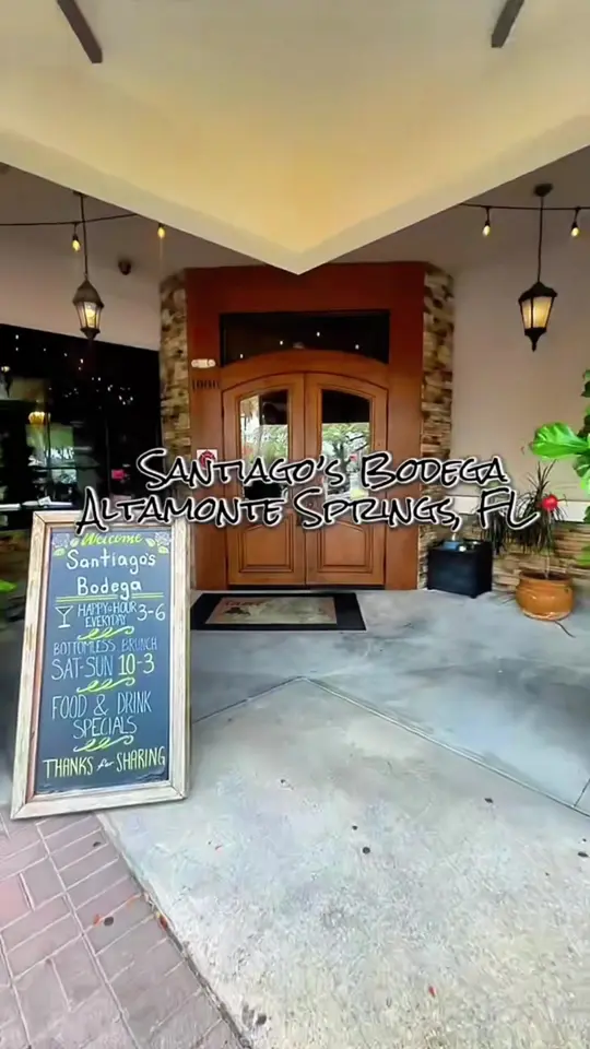 Santiago's Bodega in Orlando showing review, visit, bottomless mimosas, snow crab legs, avocado toast points, chicken & waffles, biscuits & gravy, video by vickiesflavas_ on TikTok