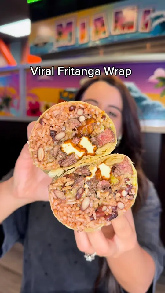 Sarussi Cafeteria and Restaurant in Miami showing food, fritanga wrap, video by Sarussi Cafe Subs on Facebook