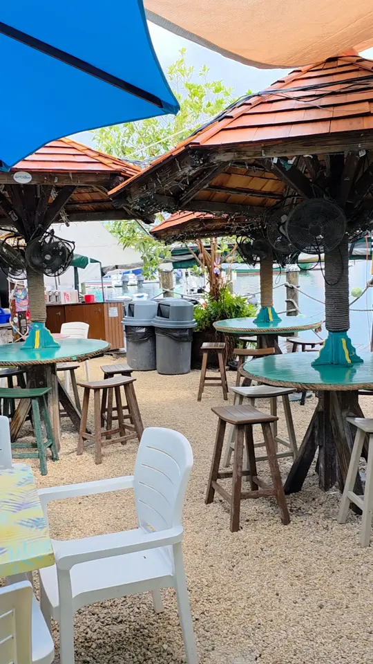 Schooner Wharf Bar in Key West showing atmosphere, harbor breeze, drink, laid-back charm, video by Key West Bars on Facebook