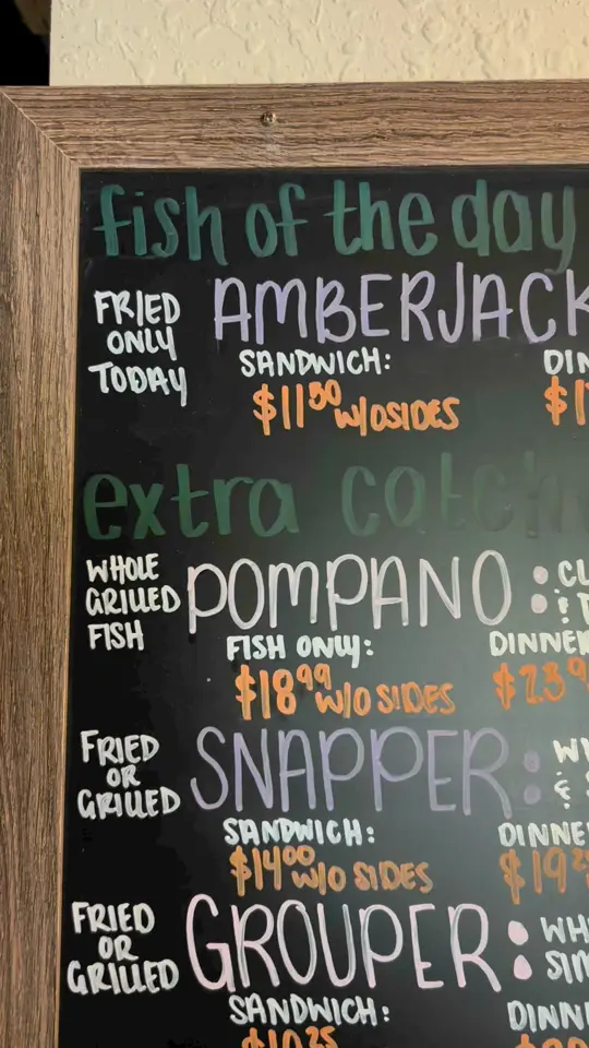Scooter's Fish House in Navarre showing menu, drink boards, video by Scooter's Fish House on Facebook