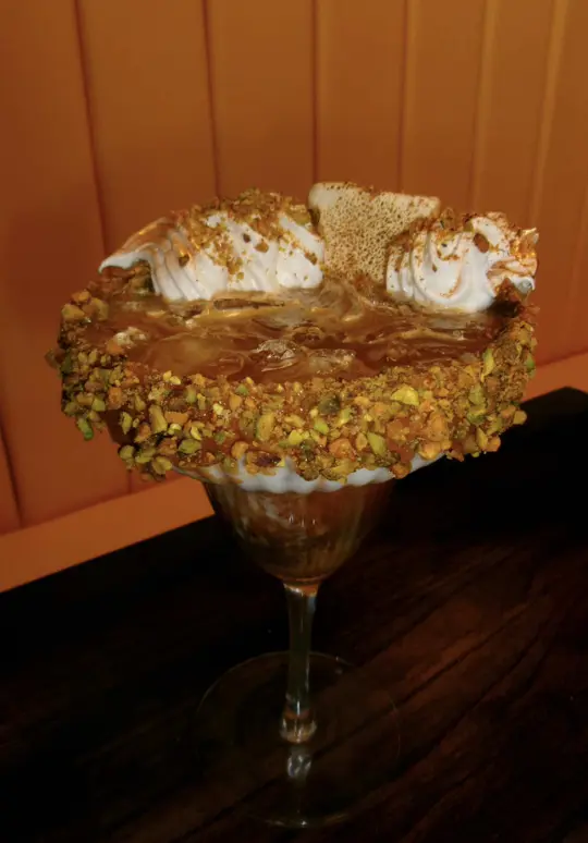 Seventy 1 Bistro in Pensacola showing breakfast, pork arepitas, mimosa, dragonfruit soda, signature pistachio latte, chicken omelette bistro, video by keepingupwithkealoha on TikTok