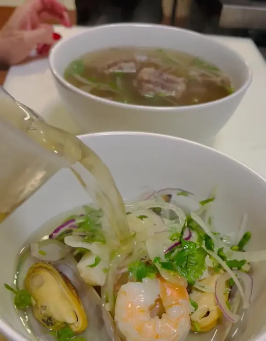 Shaking Crab seafood & pho in Bonita Springs showing seafood pho, video by Shaking Crab on Facebook