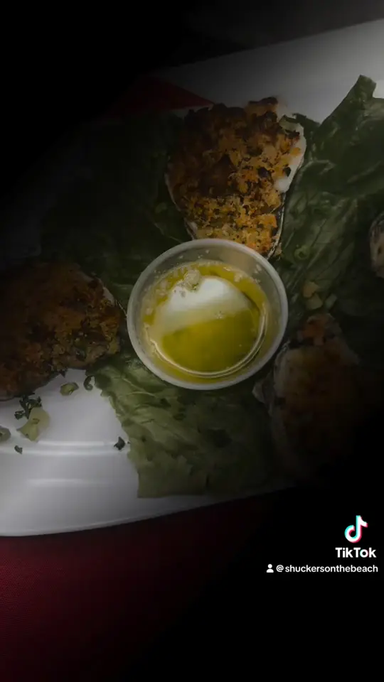 Shuckers in Jensen Beach showing happy hour, menu items, video by Shuckers & Island Beach Resort on Facebook