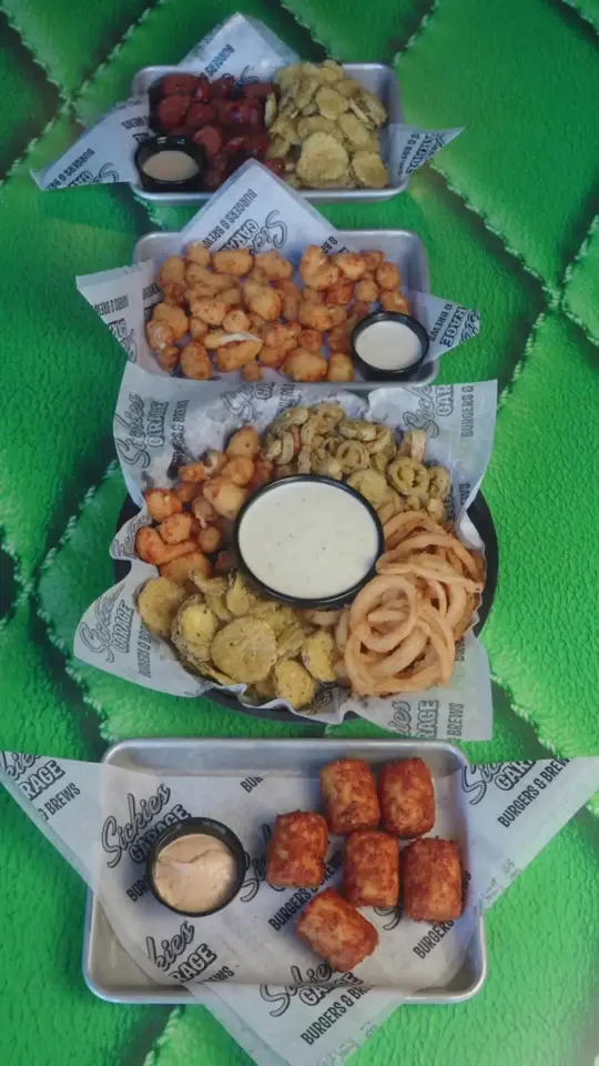 Sickies Garage Burgers & Brews in Kissimmee showing drinks, starter, video by sickiesgarage on TikTok