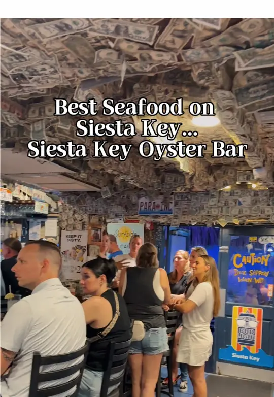 Siesta Key Oyster Bar in Sarasota showing review, fresh oysters, chicken and waffles, video by nabetsitravels on TikTok