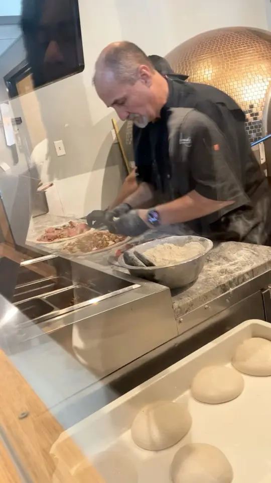Simone's Wood Fired Craft Kitchen in St. Augustine showing pizza, video by The Hughley’s on Facebook